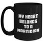 Mortician Gifts from Men, Funny Quote My Heart Belongs To A Mortician on Black Coffee Mug for Mother's Day, Mortician Unique Gifts - Main