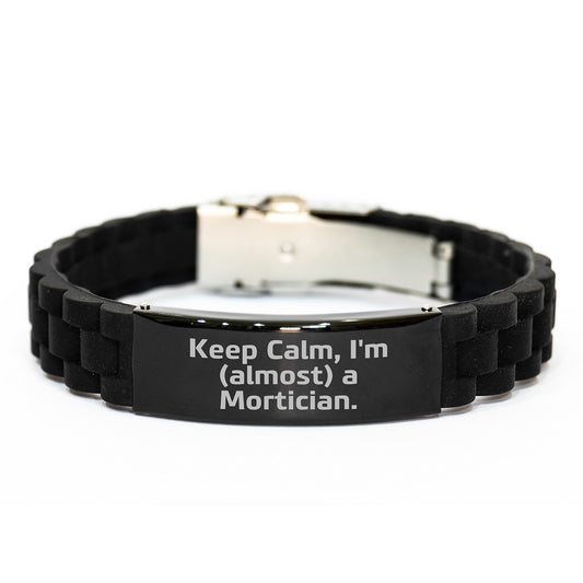 Mortician Humor Gifts from Friends, Gifts for Mortician, Keep Calm I'm (almost) A Mortician. Glide lock Clasp Adjustable Black Stainless Steel Silicone Graduation Unique Gifts - Image 1