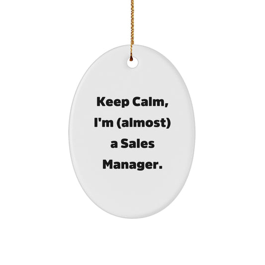 Sales Manager Gifts from Friends, 'Keep Calm, I'm (almost) A Sales Manager.' Oval Ornament for Christmas, Perfect for Coworkers - Image 1